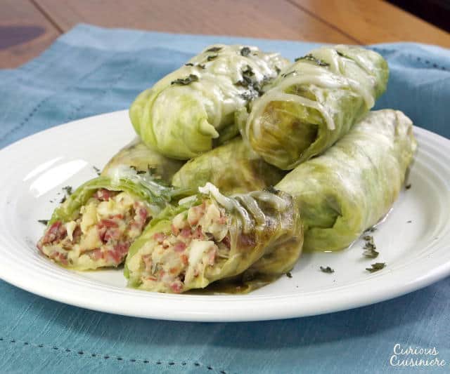 These Corned Beef Cabbage Rolls bring all the fixings of a Corned Beef Dinner into cute little bundles. They're a great way to use up St. Patrick's Day leftovers! | www.CuriousCuisiniere.com