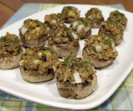 https://www.curiouscuisiniere.com/wp-content/uploads/2014/12/Swiss-Stuffed-Mushrooms-9020.1.22.450.2.jpg.webp