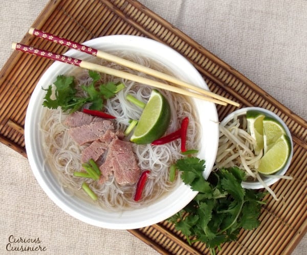 If you've never had Pho, think of it like beef noodle soup on some serious flavor steroids. This Crock Pot Pho recipe is an incredibly easy version of the classic, comforting Vietnamese soup. | www.CuriousCuisiniere.com