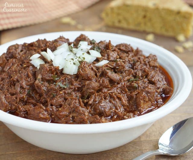 Thick and hearty Cowboy Chili, also known as Texas Red Chili, is sure to stick to your ribs and satisfy any meat lover.  | www.CuriousCuisiniere.com