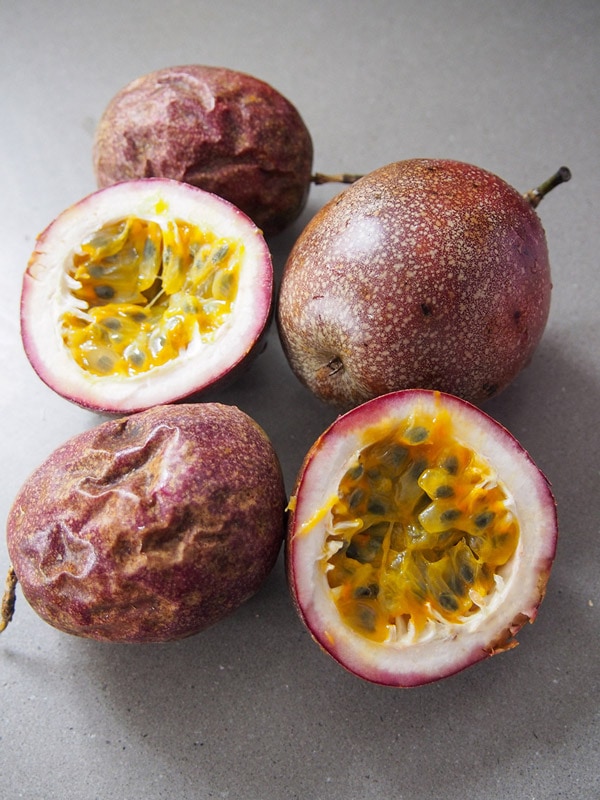 Cut and whole passion fruit