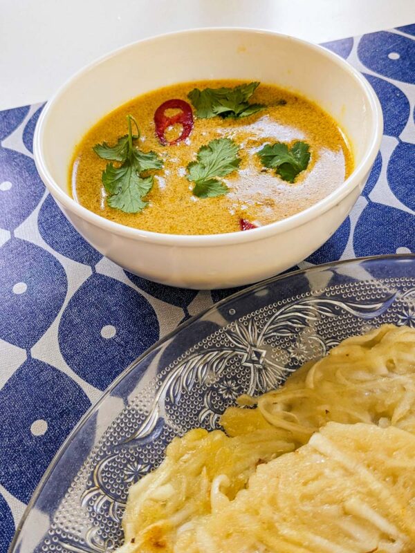 Fish curry for serving with savory coconut pancakes from Malaysia
