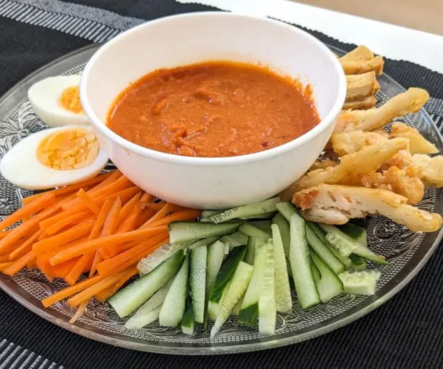 Pasembur (Malaysian Indian Rojak) salad before mixing - eggs, bean sprouts, tovu, cucumber, fritters and creamy dressing