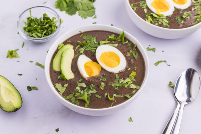 Sopa Negra (Costa Rican Black Bean Soup) - easy black bean soup with cilantro, hard boiled eggs, and avocado