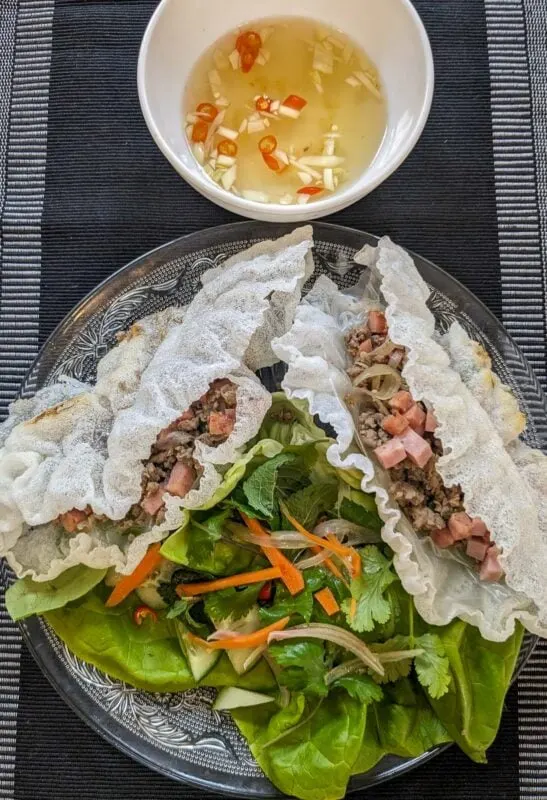 Pak mo krob - Vietnamese crispy rice paper wraps filled with pork and sausage, served with lettuce